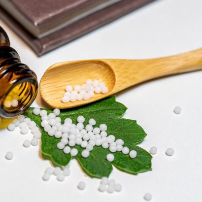Homeopathic medicine on leaf.